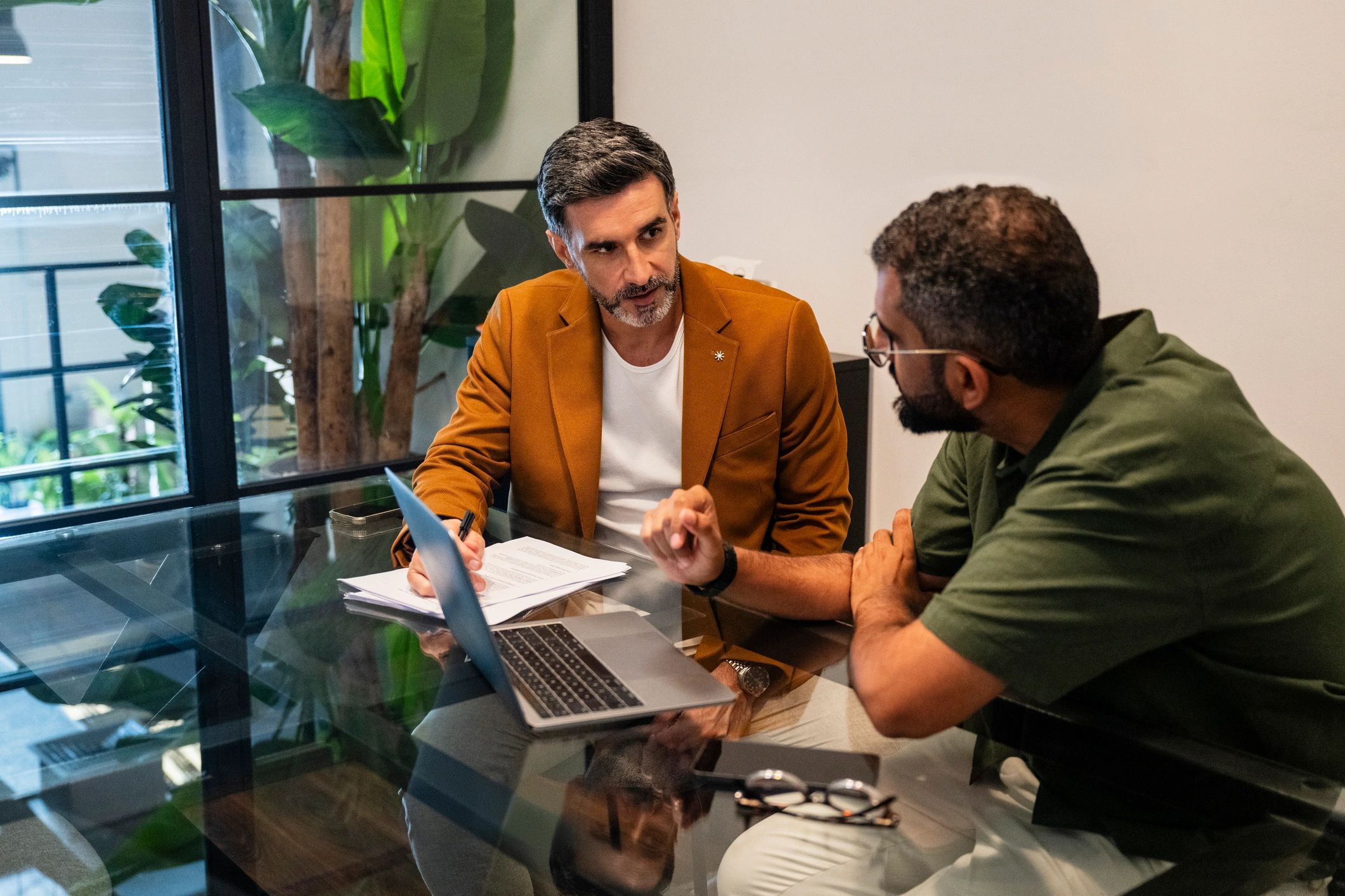 Advisor meeting with a client over financial documents