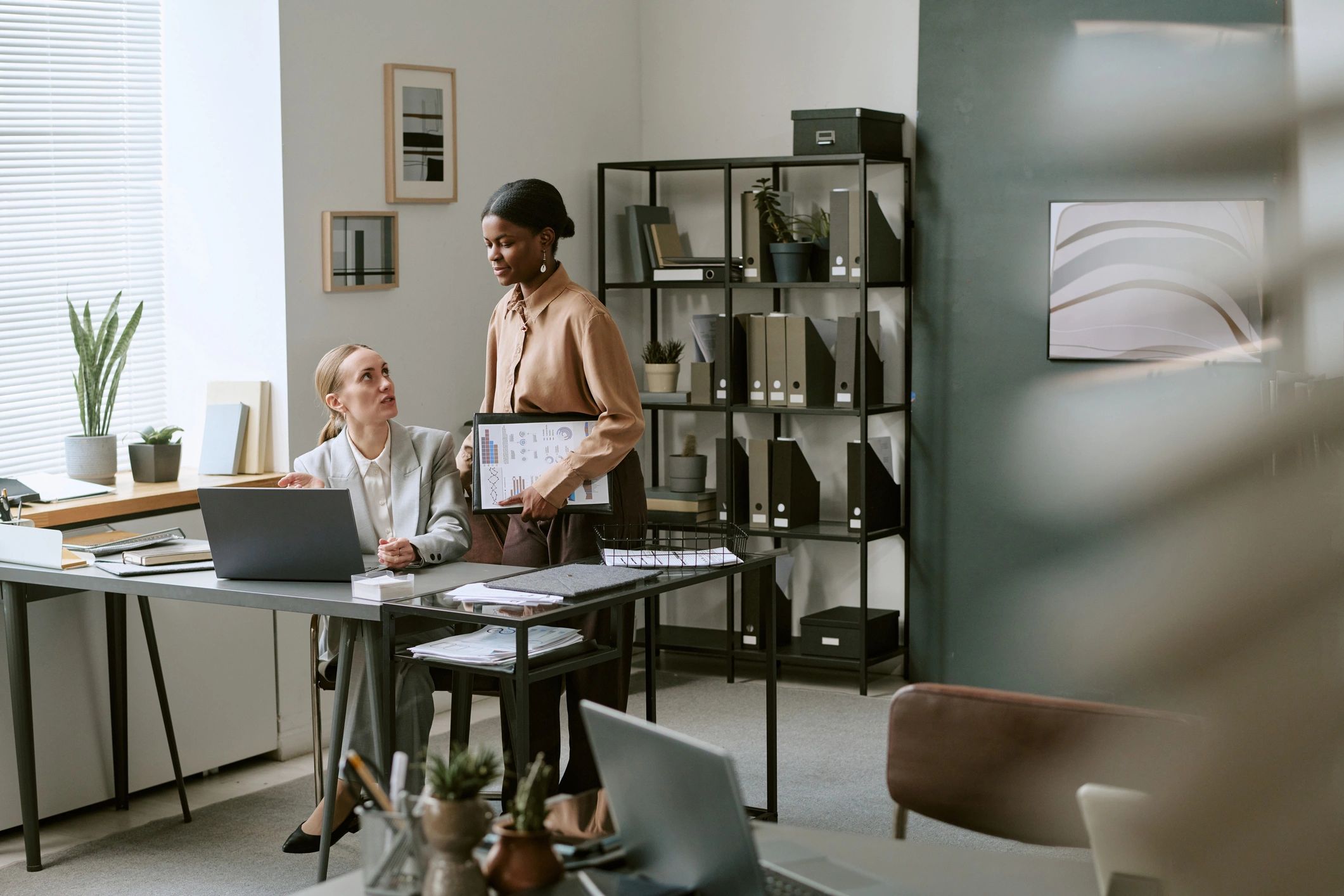 Accountant reviewing a financial report with a client
